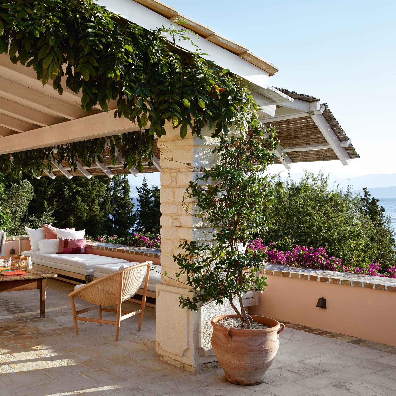 A calm and uncluttered Grecian villa brightened by a palette of soft pastel colours