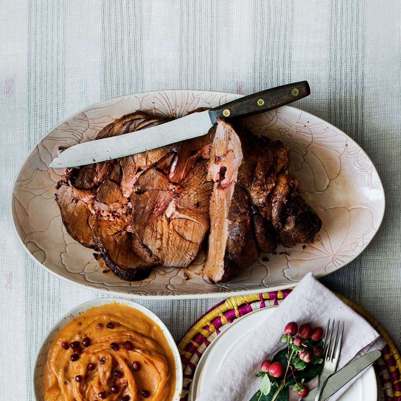 Roast haunch of venison with squash and pomegranate